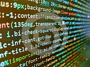 Programmer working in desktop laptop. Programming code on black background. Program code on computer screen. Information