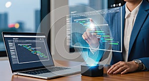 Programmer working with holographic interface and laptop displaying code