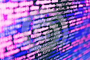 Programmer workplace. Computer script coding source code on desktop monitor. Writing programming code on laptop. Abstract