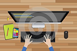 Programmer workspace view from top with desktop computer line code