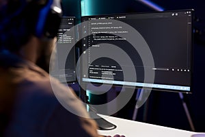Programmer writing code on computer to futureproof company network photo