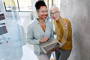 Programmers cooperating at IT company developing apps. People business work office concept