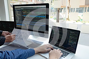 Programmers work on the development of coding and coding technology on white desks and website design, software, data processing