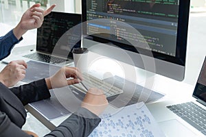 Programmers work on the development of coding and coding technology on white desks and website design, software, data processing