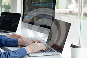 Programmers work on the development of coding and coding technology on white desks and website design, software, data processing