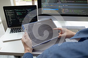 Programmers work on the development of coding and coding technology on white desks and website design, software, data processing