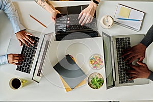 Programmers working online on computers