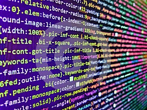 Programming code abstract screen. Desktop PC monitor photo. Php code on blue background in code editor. Abstract screen of