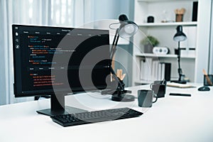 Programming code on computer screen desktop placing on working desk. Infobahn.