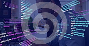 Programming code image over person working on computer in office
