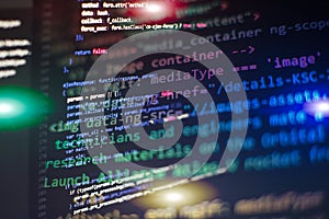 Programming code typing. Source code close-up. Programmer working on computer screen. Real software development code. Cyber space