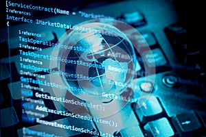 Programming code, world transparent globe earth on computer keyboard. Global communications business concept. Blue toned