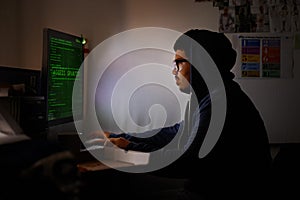 Programming, computer and man with hacker, night or cyber security with online database, malware or password phising