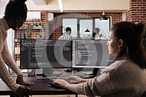 Programming engineers using computer to write code