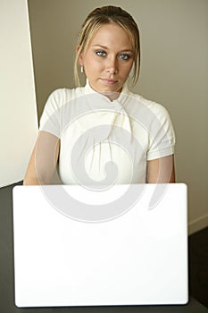 Programming girl at white computer