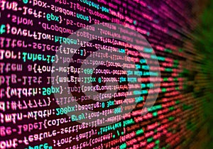 Programming Javascript on laptop computer screen. Big data concepts working in cyberspace environment. Programming source code