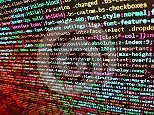 Programming Javascript on laptop computer screen. Software developer programming code on computer. Data encryption security code