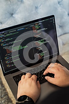 Programming language concept. Programmer profession - writing programming code on laptop