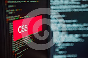 Programming language, CSS inscription on the background of computer code.