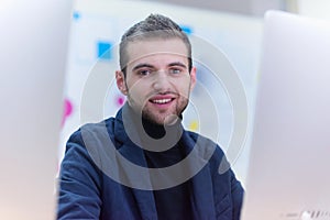 Programming. man working on computer in it office, sitting at desk writing codes. Programmer typing data code, working on project