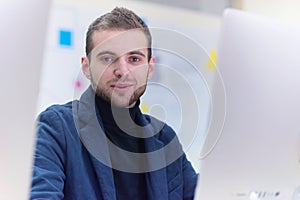 Programming. man working on computer in it office, sitting at desk writing codes. Programmer typing data code, working on project