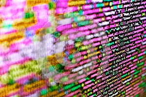Programming source code abstract screen of software developer. Data encryption security code on a computer display, close up.