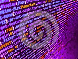 Programming, webdesign HTML printed code. Data encryption security code on a computer display, close up. Front-end applications in