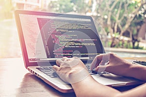 Programming Work Time. Programmer Typing New Lines of HTML Code. Laptop and Hand Closeup.