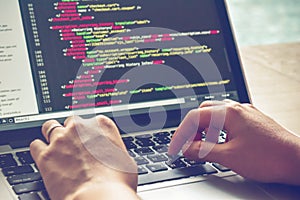 Programming Work Time. Programmer Typing New Lines of HTML Code. Laptop and Hand Closeup.