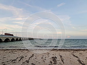 Progreso is a Mexican port city on the Yucatan Peninsula with its iconic arched pier and famous boardwalk photo