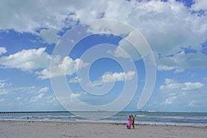 Progreso, Yucatan, Mexico: A young couple standing on a  beach on the Gulf of Mexico photo