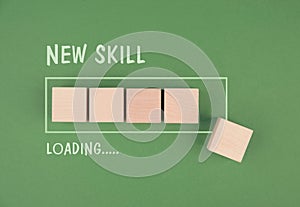 Progress bar with the words new skill loading, education concept, having a goal, online learning, knowledge is power strategy