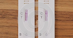 Progress of two Covid-19 antigen tests, side by side. One test becomes positive and one negative. Coronavirus, self at home tests