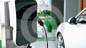 Progressive concept of home charging station providing clean energy for EV cars.