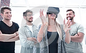 Progressive girl smiling while wearing virtual reality glasses