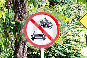 Prohibition sign for car and motorbikes side street or no cars are allowed to run inside.