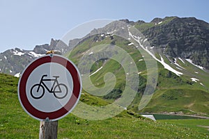 Prohibition Traffic sign No bicycles attached on a wooden pole.