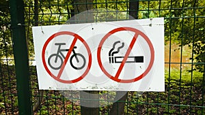 prohibitory signs not to smoke not to ride a bicycle in park