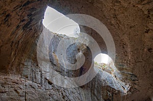 Prohodna cave in Bulgaria famous for the God\'s eyes holes in the ceiling