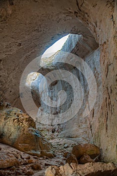 Prohodna cave in Bulgaria famous for the God\'s eyes holes in the ceiling