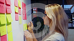 Project management agile methodology, concept. A young blonde woman in glasses