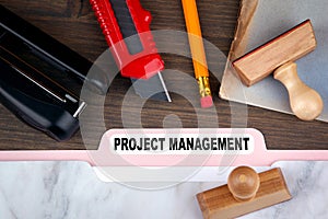 Project management concept. Folder Register on a dark wooden desk