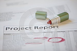 Project report marked up with lip stick