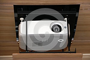 Projector hanging on meeting room ceiling