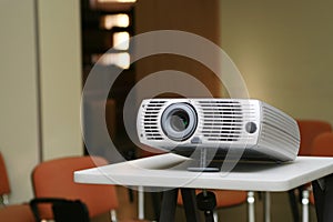 Projector on stand ready for presentation at office