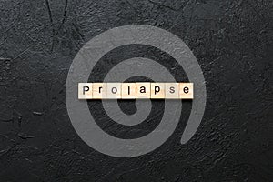 prolapse word written on wood block. prolapse text on table, concept photo