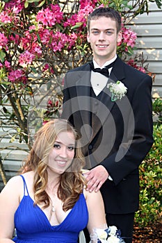 Prom Couple Portrait with Girl Sitting