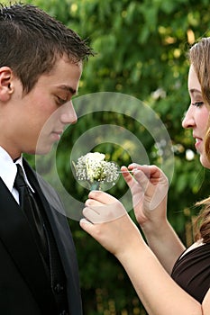 Prom Couple Preparing Boutonniere