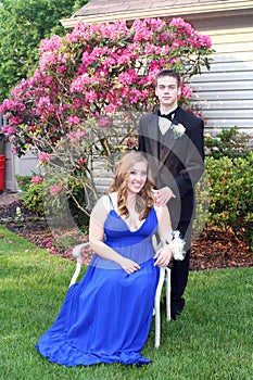 Prom Girl Sitting Beside Date Outdoors