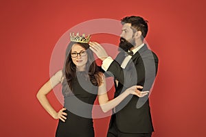 Prom queen. Bearded man crown sexy girl. Coronation party. Prom couple in formal style. Prom party. Holiday celebration